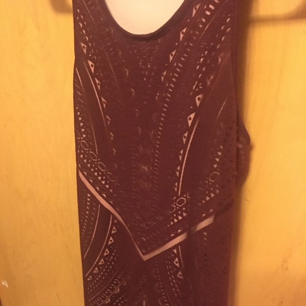 Wine colored body con dress with a razor back.